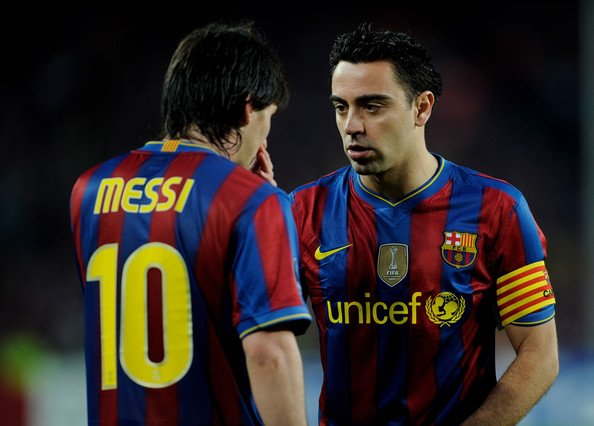 http://sportige.com/wp-content/uploads/2011/07/Messi-Xavi.jpg