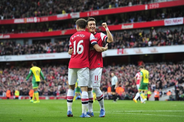 Mesut Ozil scored his first two goals in the Premier League for Arsenal as they won 4-1.