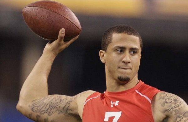 FILE - This Feb. 27, 2011, file photo shows Nevada quarterback Colin Kaepernick during the NFL football scouting combine in Indianapolis. With the NFL draft less than three weeks away, Kaepernick is busy visiting teams interested in selecting him. He's scheduled to take 13 trips and, he said, three more are in the works. Plus, a few more teams are coming to Reno, Nevada, to watch him work out, he said. (AP Photo/Darron Cummings, File)