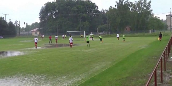 Footballer Celebrates by Jumping into a Puddle